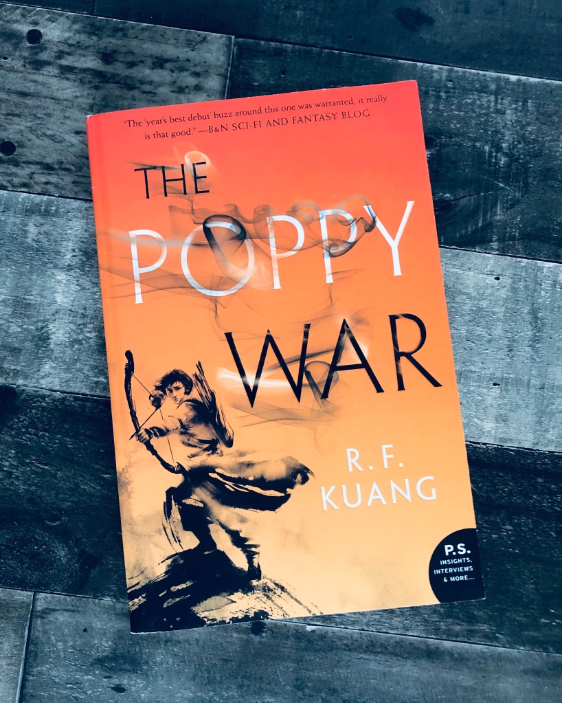 THE POPPY WAR by R.F. Kuang set against a dark, multi-colored background.